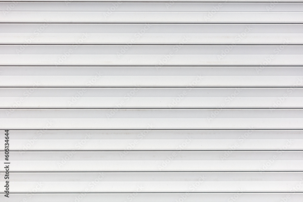 White metal roller shutter door texture background. Texture of white metal roller shutter door White metal roller shutter door texture background. Texture of white metal roller shutter door