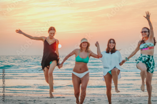 Group of girls having fun on the beach