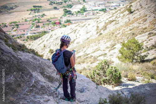 Climbing sports technician check the condition of a via ferrata photo