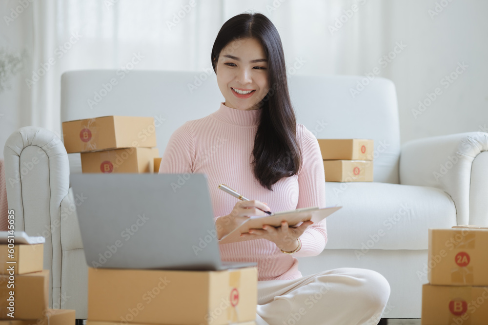 Online Seller, Young Asian store owner, she makes a living selling products online, live selling on social media platforms to reach target audience. Concept of selling products online. Online Seller, Young Asian store owner, she makes a living selling products online, live selling on social media platforms to reach target audience. Concept of selling products online.