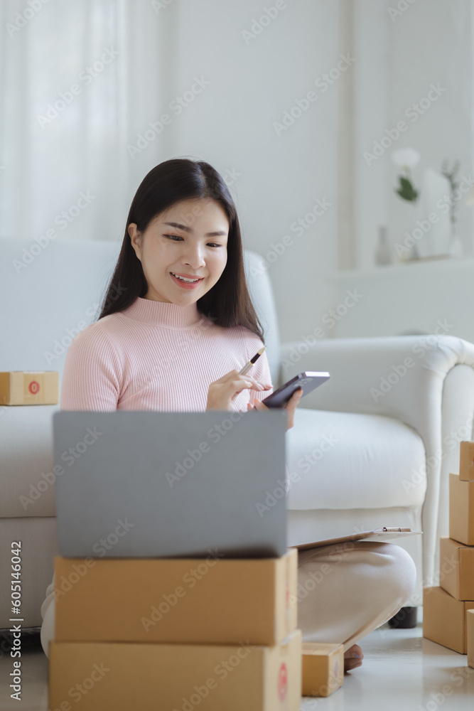 Online Seller, Young Asian store owner, she makes a living selling products online, live selling on social media platforms to reach target audience. Concept of selling products online. Online Seller, Young Asian store owner, she makes a living selling products online, live selling on social media platforms to reach target audience. Concept of selling products online.