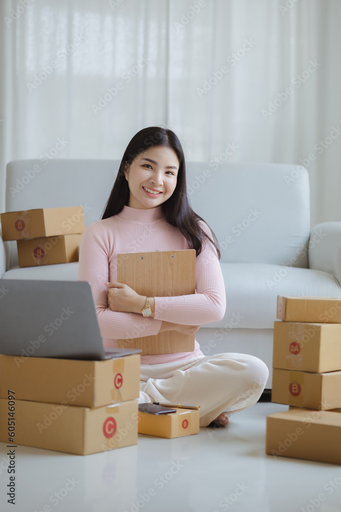 Online Seller, Young Asian store owner, she makes a living selling products online, live selling on social media platforms to reach target audience. Concept of selling products online. Online Seller, Young Asian store owner, she makes a living selling products online, live selling on social media platforms to reach target audience. Concept of selling products online.