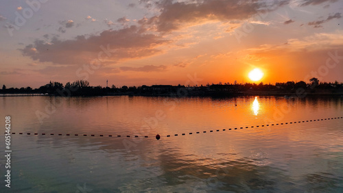 Panorama of the sunset on the lake in summer