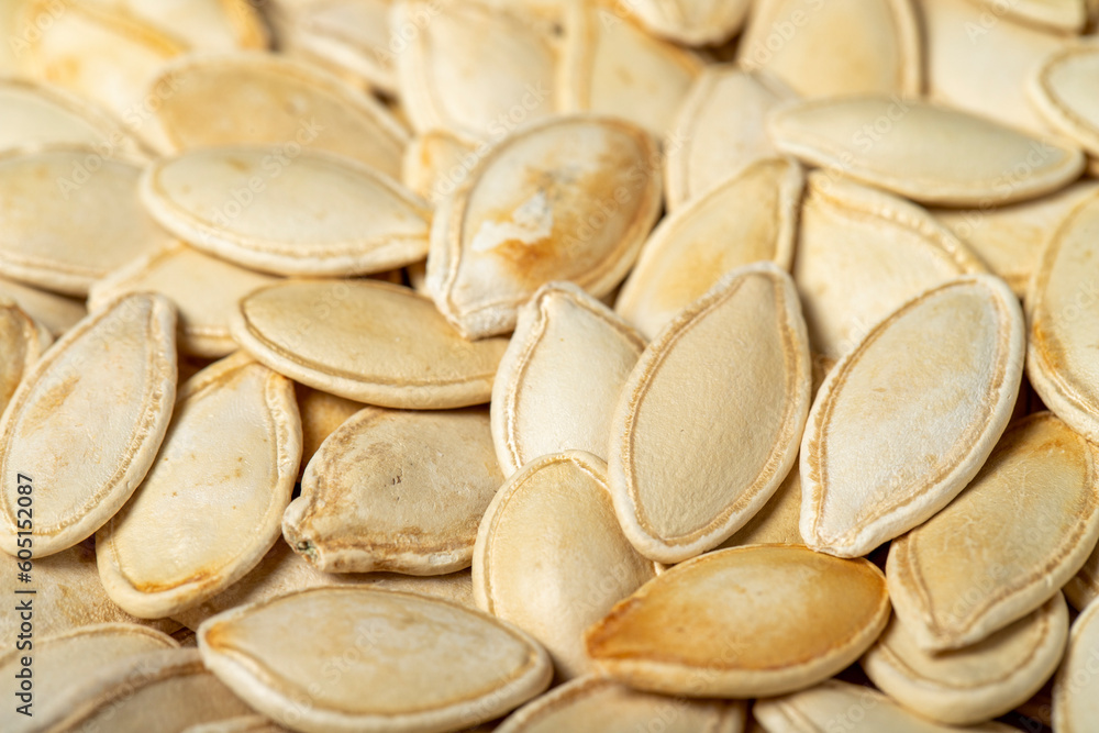 Pumpkin seeds. Sun-dried pumpkin seeds closeup food background. texture. copy space banner Pumpkin seeds. Sun-dried pumpkin seeds closeup food background. texture. copy space banner