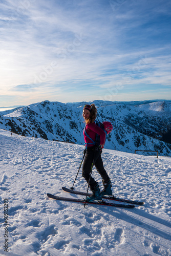 Woman on backcountry ski tour, Chopok, slovakia Mountaineer backcountry ski walking ski alpinist in the mountains. Ski touring in alpine landscape with snowy trees. Adventure winter sport. Tatras, slo