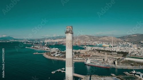 4K Side-View Drone Footage: Abandoned Factory Chimney in Athens with Port of Piraeus and Sea (ID: 605152685)