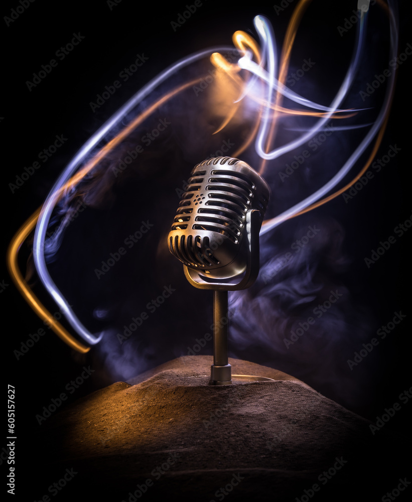 Microphone for sound, music, karaoke in audio studio or stage. Mic  technology. Speech broadcast equipment. Microphone in dark room on table  with backlight. Selective focus Photos | Adobe Stock