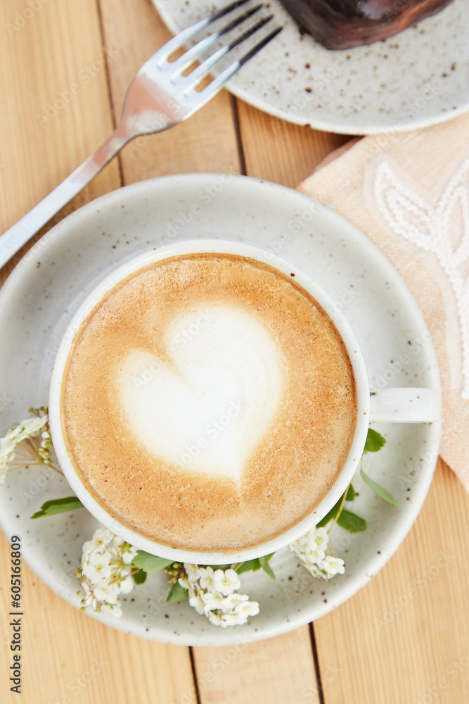 Coffee cup top view. Creamy cappuccino with heart shape foam Coffee cup top view. Creamy cappuccino with heart shape foam