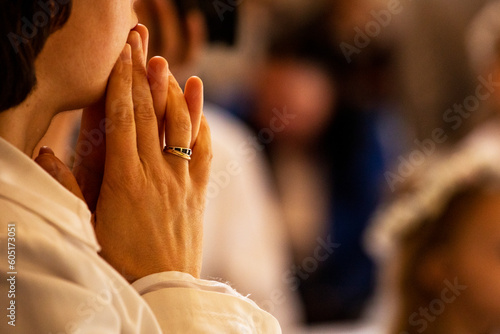 Fotografie, Tablou woman's hands while praying at holy mass. horizontal