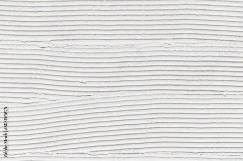 Wall surface with adhesive paste before laying a tile