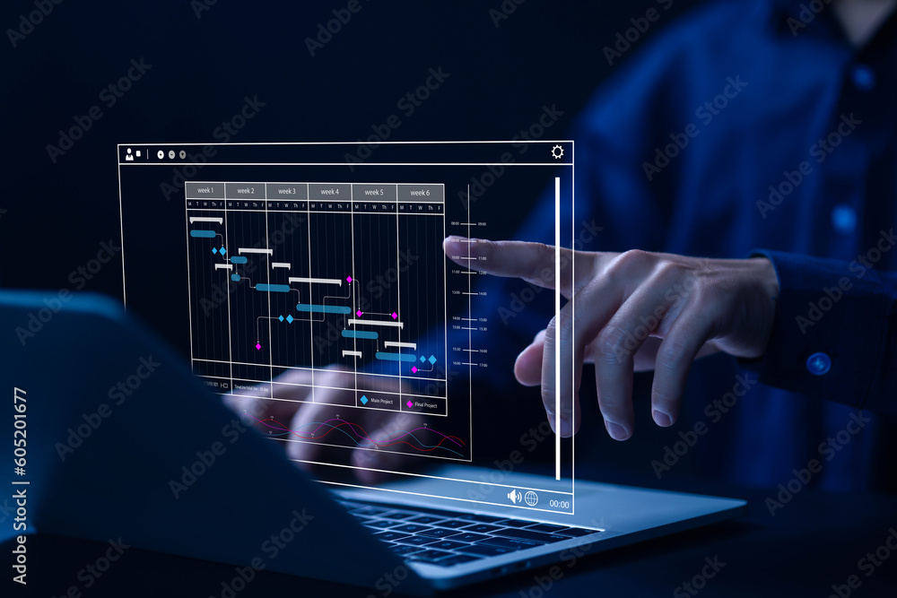 business manager managing business planning project schedules in the office. Gantt chart showing on virtual screen.
business manager managing business planning project schedules in the office. Gantt chart showing on virtual screen.