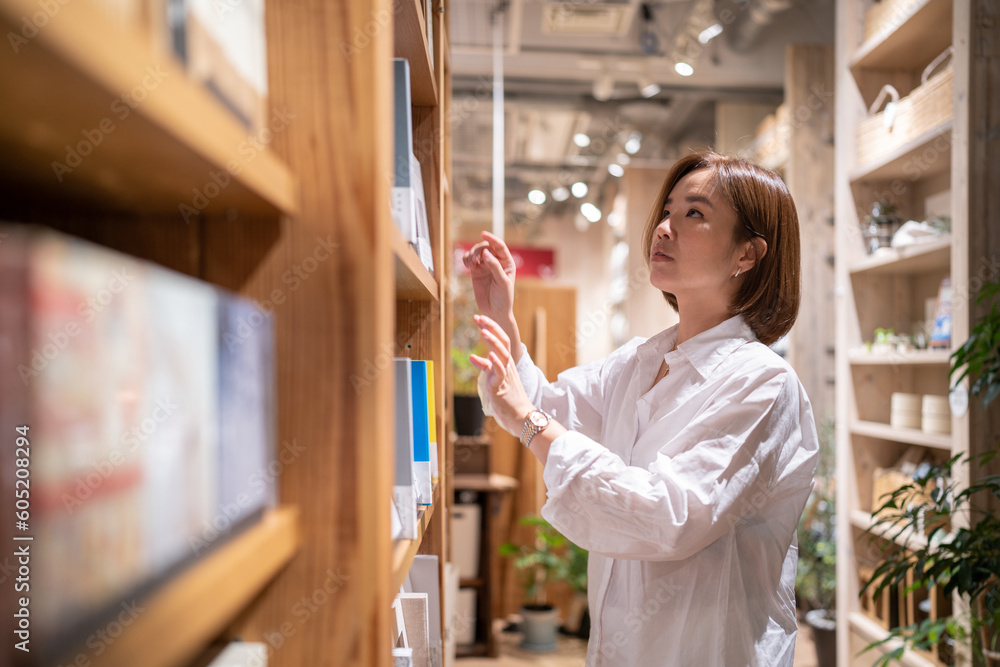 An asian woman in the bookstore. An asian woman in the bookstore.