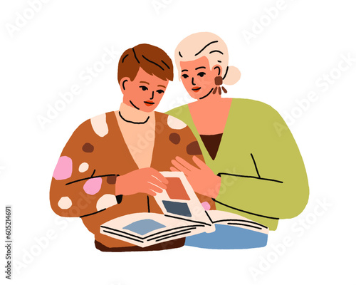 Women friends looking photographs in photo album, paper book. Girlfriends wit...