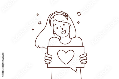 Smiling girl show heart on paper 