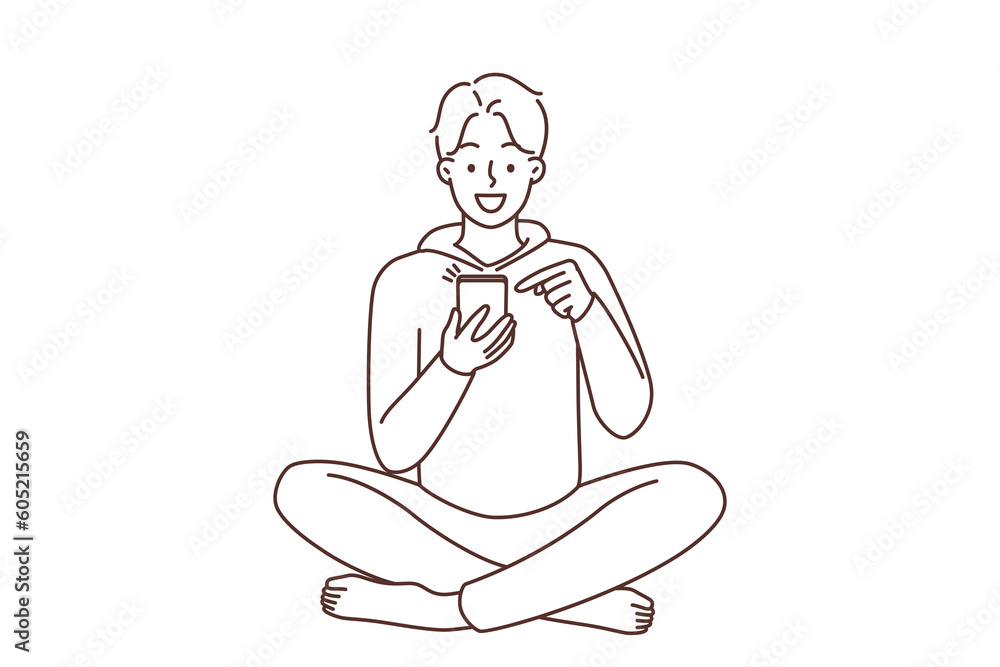 Smiling man using cellphone 