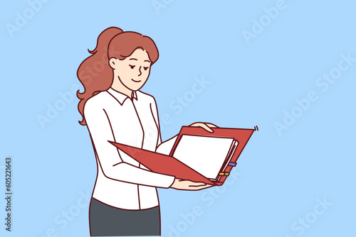 Woman is holding folder with documents reading report from employees or preparing for business presentation. Girl in business clothes is engaged in paperwork working as secretary in large corporation.