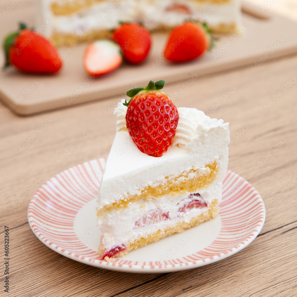 Slice of fresh strawberry shortcake with whipped cream, Japanese style Slice of fresh strawberry shortcake with whipped cream, Japanese style