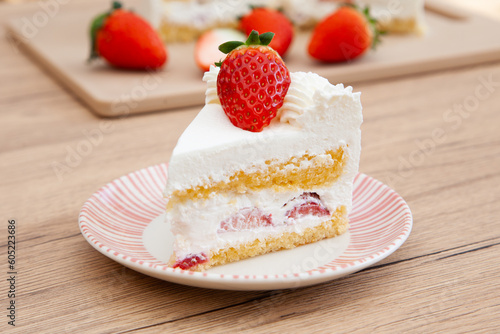 Fotografie Slice of fresh strawberry shortcake with whipped cream, Japanese style