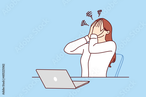 Business woman using laptop experiencing stress after making mistake or sending email to wrong recipient. Girl manager in business clothes suffers from stress associated with professional burnout