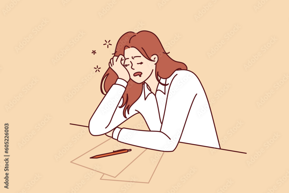 Tired girl student sleeps sitting at table with papers while filling out test or preparing for exams. Concept of burnout and overload during training before college or university entrance exams Tired girl student sleeps sitting at table with papers while filling out test or preparing for exams. Concept of burnout and overload during training before college or university entrance exams
