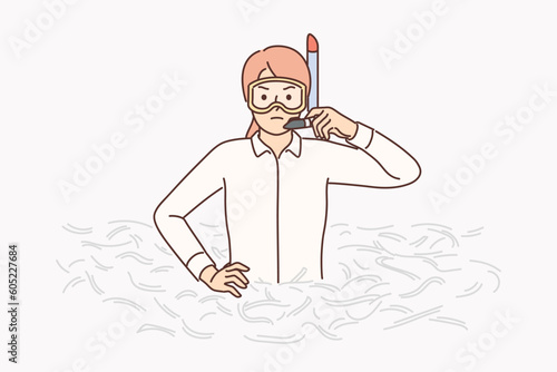 Businesswoman in diving mask stands in pile of paper for concept need for crisis management.