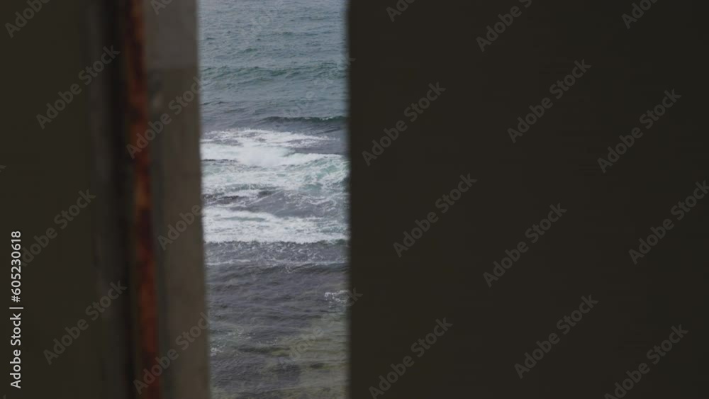view of sea waves through the door view of sea waves through the door