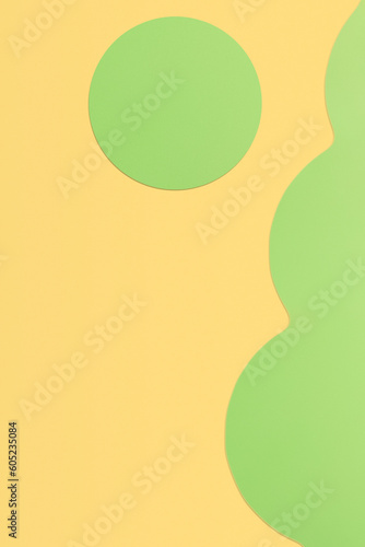 Paper yellow background with shaped green elements.