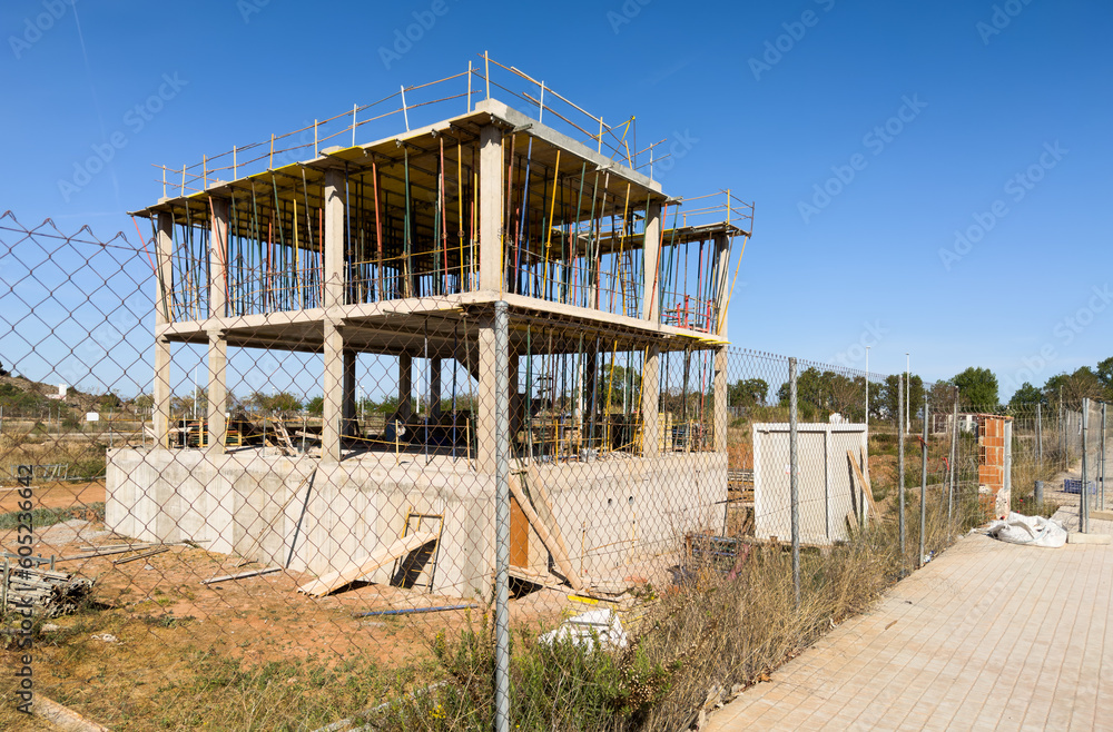 Villa under construction. Townhouse on Construction site. Luxury villa under construction near beach of Mediterranean sea. Construction of modern house near coastline. Home renovation near ocean. Villa under construction. Townhouse on Construction site. Luxury villa under construction near beach of Mediterranean sea. Construction of modern house near coastline. Home renovation near ocean.