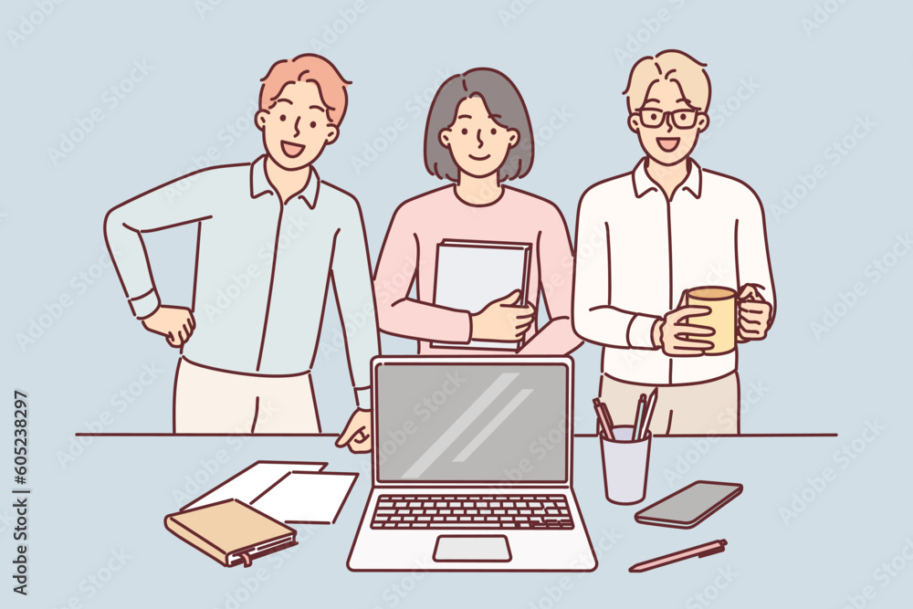 Business team smiling standing near desk with laptop in office and reporting to manager on work done Business team smiling standing near desk with laptop in office and reporting to manager on work done