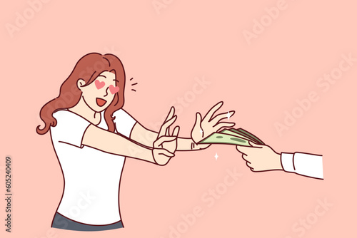 Excited woman reaches for money in man hand for concept of financial reward or payment for services. Young girl joyfully receives first money salary for work performed or goods sold.