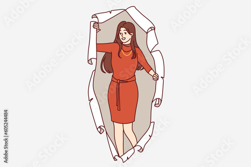 Woman in evening dress peeks out of hole in torn paper offering to attend party together. Young long-haired girl in elegant dress for carnival or corporate party smiles and looks at screen