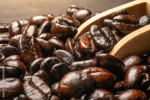 Dark roast coffee beans on a black background