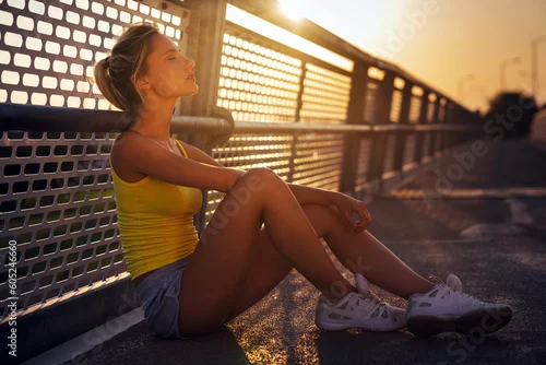 Obraz Portrait of fit sporty young woman in city. People sport exercise urban healthy lifestyle concept
