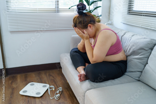 Fotografia Obese Woman with fat upset bored of dieting Weight loss fail  Fat diet and scale