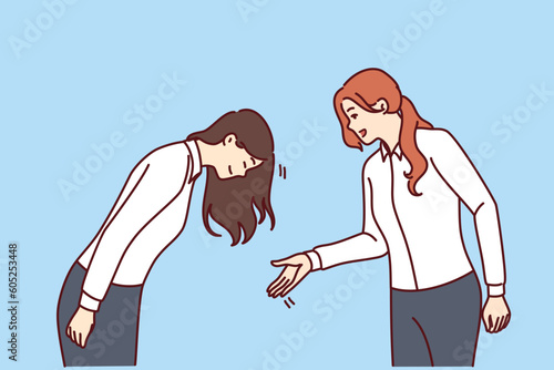 Woman greets asian colleague or potential business partner bows as sign of respect and loyalty. Business people from different ethnic groups demonstrate familiar greetings from their own culture