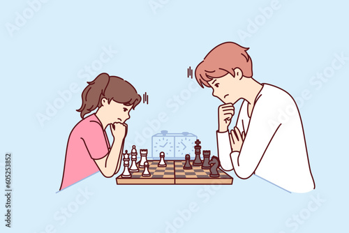 Game of chess between man and teenage girl during training of professional grandmaster or preparation for sports tournament. Father and daughter play chess to develop child strategic thinking