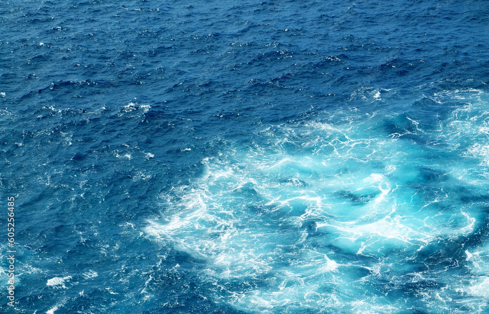 Abstract blue turquoise ocean water background.Sea waves natural texture for design.Selective focus. Abstract blue turquoise ocean water background.Sea waves natural texture for design.Selective focus.