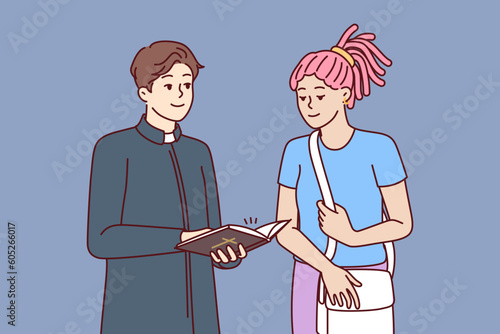 Man priest from catholic church stands near woman come to temple for blogging or confession. Religious girl wants to confess in church to find peace and harmony or forgiveness of sins