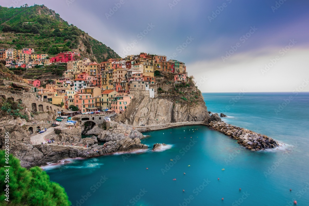 Picturesque colorful village situated on the edge of a cliff in Manarola, Cinque Terre, Italy