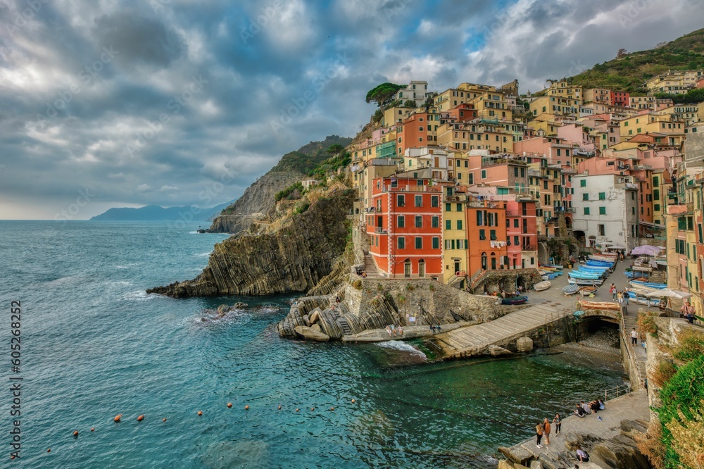 Stunning view of a picturesque coastal town on the edge of a cliff in Riomaggiore, Cinque Terre