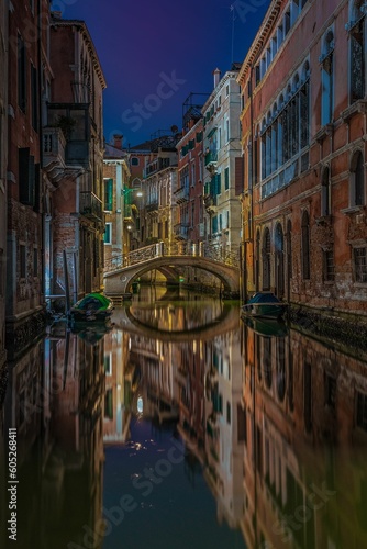 Fototapeta Picturesque scenery around the tranquil canals at night in Venice, Italy