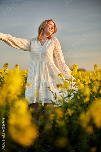 redhead girl in white in raps field