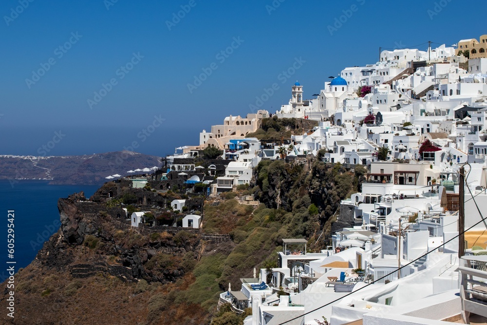 Aerial view of the coastal town of Oia in Santorini, Greece in summer on a sunny day