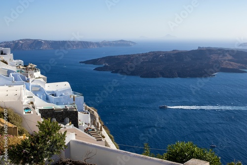 Aerial view of a blue ocean in summer with a blue sky in the background in Oia, Santorini