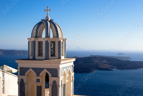 Exterior view of a church in the coastal town of Oia in Santorini, Greece in sunny weather