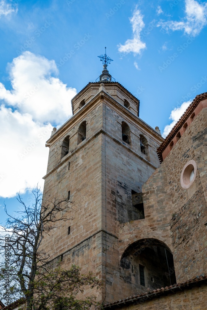 Low angle shot of the tower of Albarracin Cathedral in Teruel, Aragon, Spain