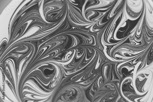 Grayscale shot of an abstract graphic image with flowerpatterns photo