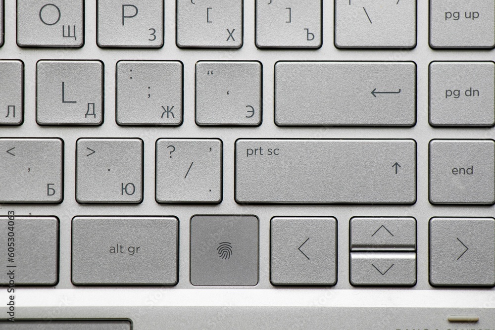 Close-up shot of a gray laptop keyboard