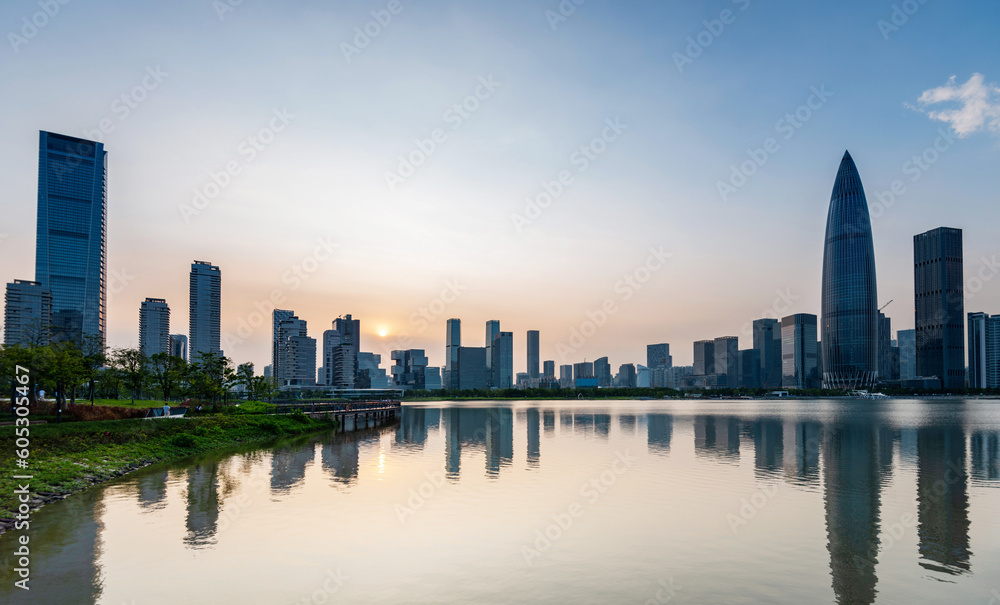 Office building reflected in the water at sunset