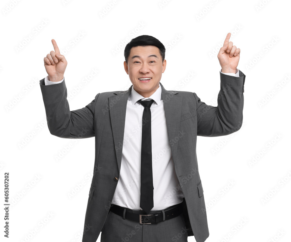 Businessman in suit pointing at something on white background Businessman in suit pointing at something on white background